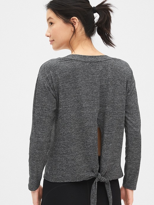 2 of 8 showing, with the color medium gray of product GapFit Tie-Back Sweatshirt in Brushed Tech Jersey
