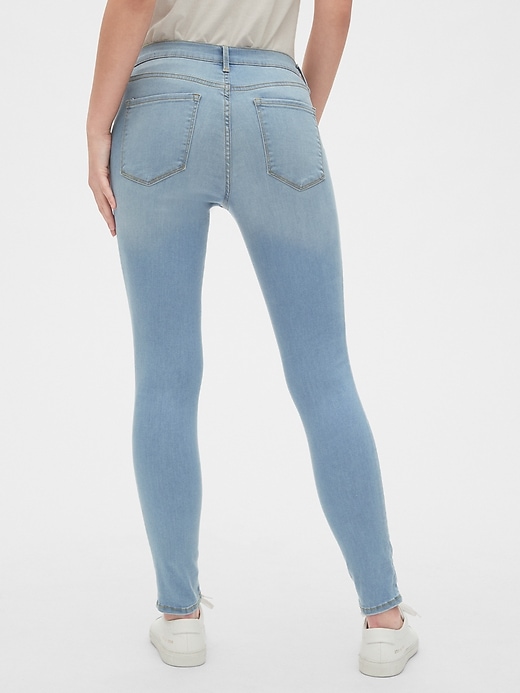 2 of 8 showing, with the color (Light) Light Indigo of product Mid Rise True Skinny Jeans in Sculpt