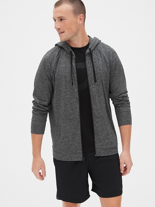 1 of 8 showing, with the color charcoal of product Gapfit Brushed Tech Jersey Full-Zip Hoodie
