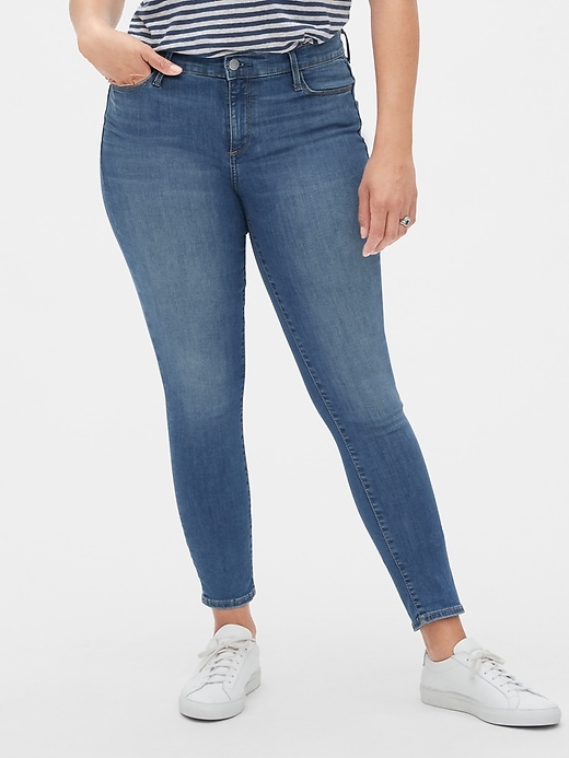 1 of 8 showing, with the color (Medium) Medium Indigo of product Mid Rise True Skinny Jeans in Sculpt With Washwell™