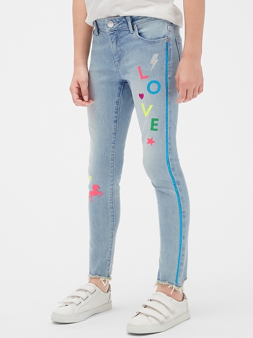 2 of 8 showing, with the color medium wash of product Kids Glitter Graphic Skinny Jeans with Stretch