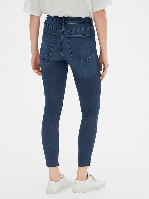 2 of 8 showing, with the color dark indigo of product Mid Rise Favorite Jeggings with Raw Hem