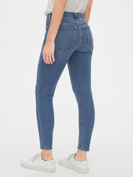 2 of 8 showing, with the color medium destroy of product Soft Wear Mid Rise True Skinny Ankle Jeans