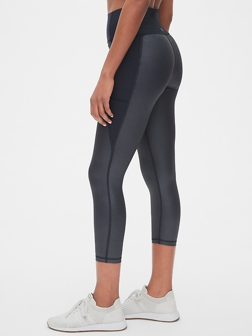 View large product image 1 of 1. GapFit High Rise Perforated Pocket 7/8 Leggings in Sculpt Revolution