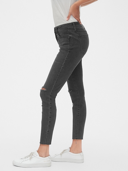 Image number 1 showing, Mid Rise Curvy Distressed True Skinny Ankle Jeans