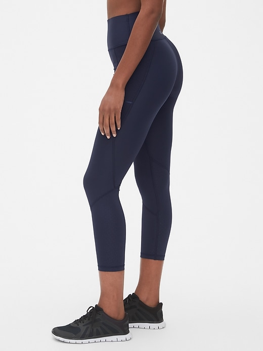 View large product image 1 of 1. High Rise Perforated Spliced 7/8 Leggings in Sculpt Revolution