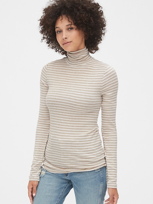 1 of 8 showing, with the color oatmeal stripe of product Stripe Ribbed Turtleneck Top in Modal