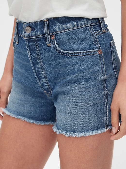 Image number 5 showing, High Rise Cheeky Denim Shorts with Raw Hem