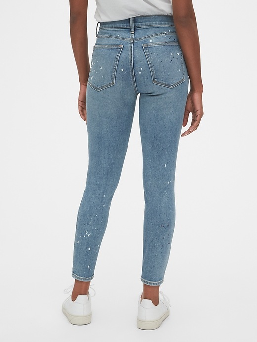 2 of 8 showing, with the color medium indigo of product High Rise Destructed True Skinny Ankle Jeans with Secret Smoothing Pockets