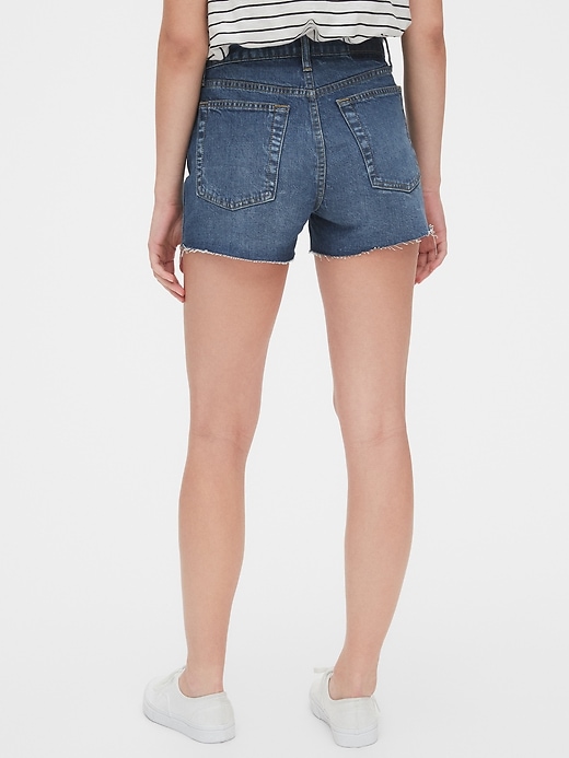 Image number 7 showing, High Rise Cheeky Denim Shorts with Raw Hem