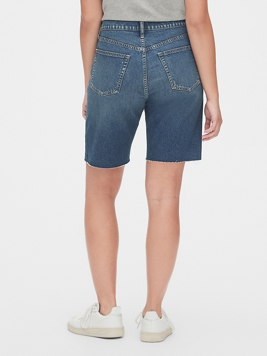 2 of 8 showing, with the color dark indigo of product High Rise Distressed Denim Bermuda Shorts