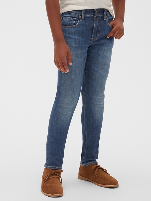 2 of 8 showing, with the color dark wash indigo of product Kids Skinny Jeans with Washwell™