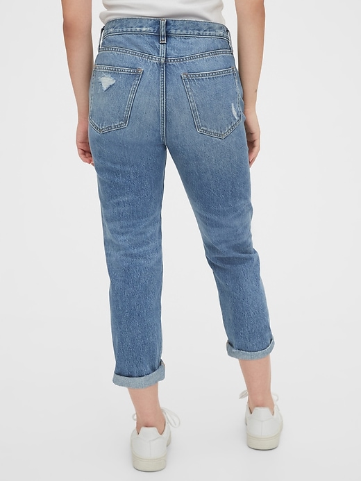 2 of 8 showing, with the color medium indigo of product Mid Rise Destructed Boyfriend Jeans