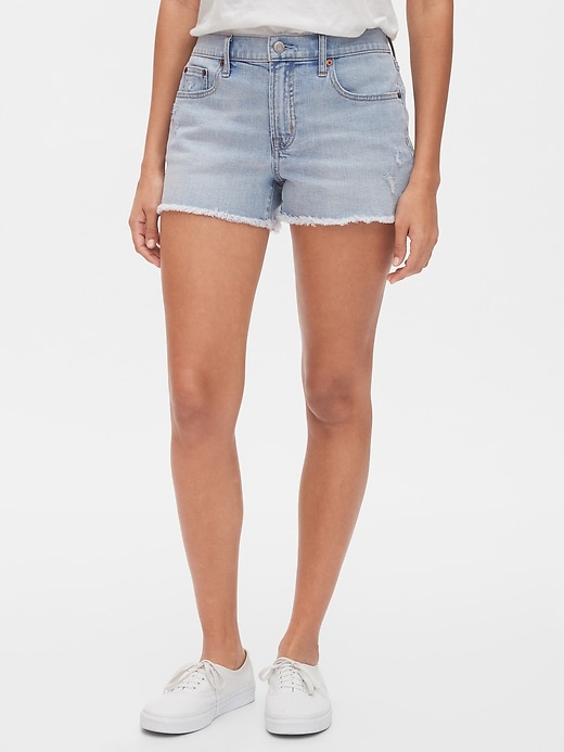 1 of 8 showing, with the color bleached of product Distressed Mid Rise Denim Shorts