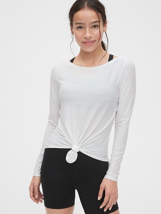 1 of 8 showing, with the color white of product Gapfit Breathe Knot-Front Long Sleeve T-Shirt
