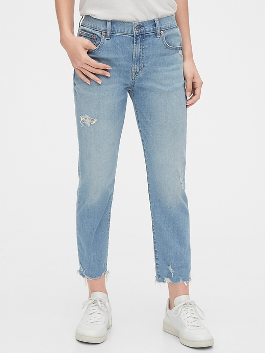 1 of 8 showing, with the color medium destroy of product Mid Rise Destructed Girlfriend Jeans