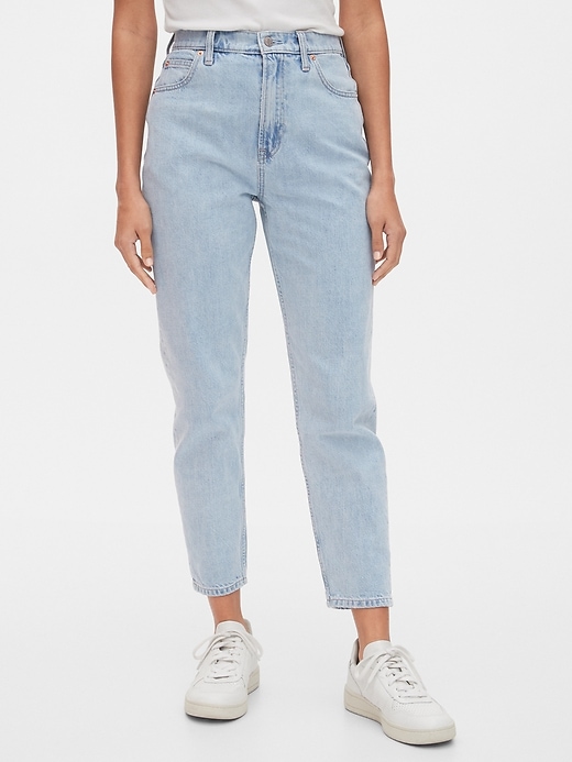 1 of 8 showing, with the color light indigo of product Sky High Rise Mom Jean with Washwell™