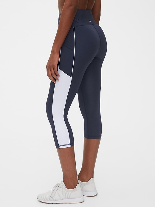 1 of 8 showing, with the color true indigo blue of product GapFit High Rise Capri Leggings in Sculpt Revolution