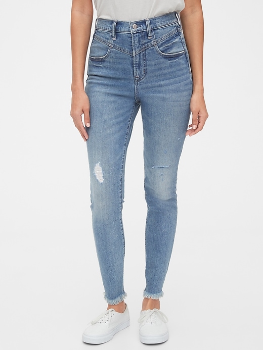 1 of 8 showing, with the color medium indigo of product Sky High Destructed True Skinny Ankle Jeans