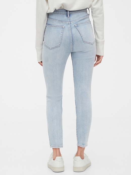 2 of 8 showing, with the color light indigo destroy of product Sky High Destructed True Skinny Ankle Jeans