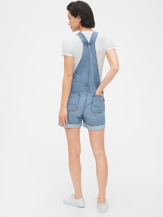 2 of 8 showing, with the color light indigo of product Denim Shortalls With Raw Hem