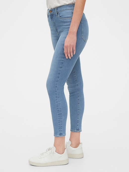 1 of 8 showing, with the color medium indigo of product High Rise True Skinny Ankle Jeans in Sculpt