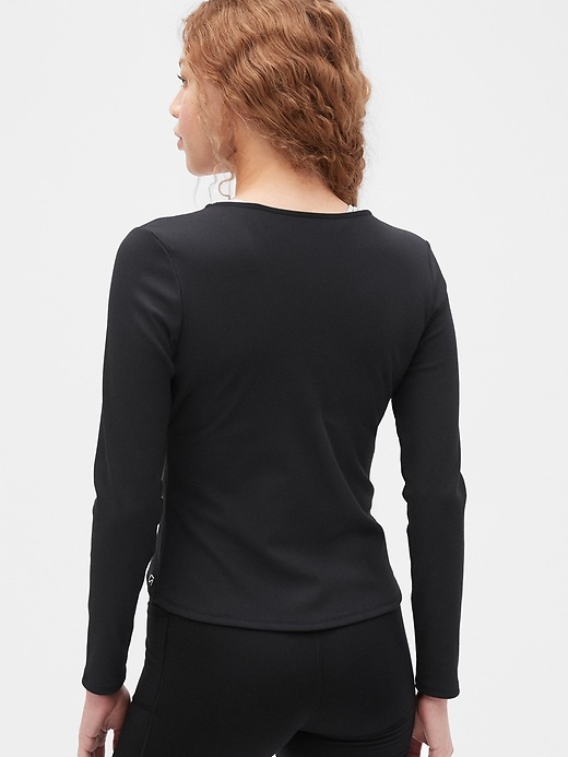 View large product image 2 of 6. GapFit Blackout Rib Long Sleeve Wrap Front Top