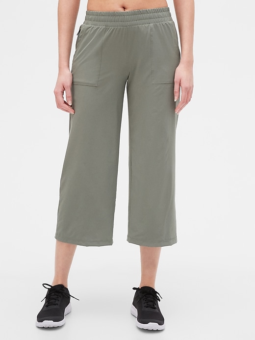 1 of 8 showing, with the color vintage palm green of product GapFit Runaround Crop Pants