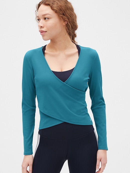 1 of 8 showing, with the color slate teal blue of product GapFit Blackout Rib Long Sleeve Wrap Front Top