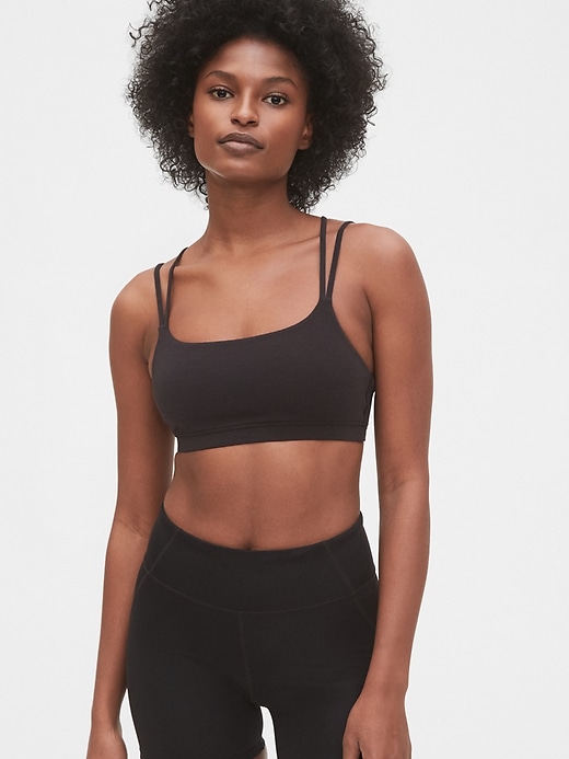 1 of 8 showing, with the color true black of product GapFit Breathe Low Support Strappy Sports Bra