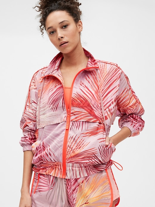 1 of 8 showing, with the color pink coral palm print of product GapFit Lighweight Windbreaker