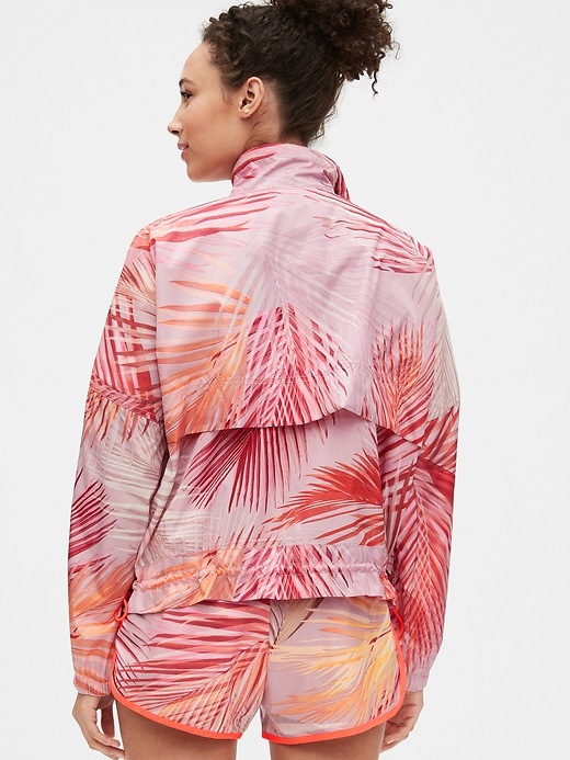 2 of 8 showing, with the color pink coral palm print of product GapFit Lighweight Windbreaker