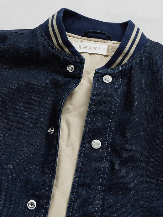 denim varsity jacket with khaki sleeves