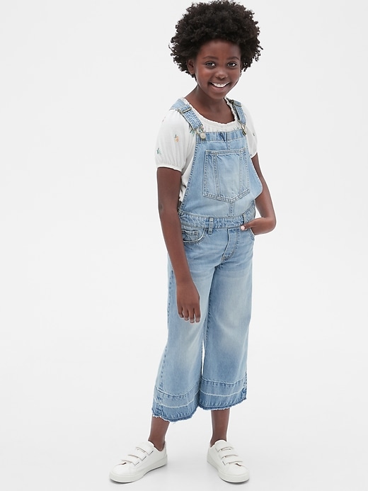 1 of 8 showing, with the color medium wash of product Kids Wide-Leg Overalls