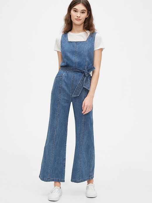 1 of 8 showing, with the color medium wash of product Squareneck Wide-Leg Denim Jumpsuit