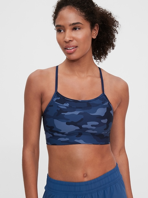 1 of 8 showing, with the color blue camo of product GapFit Low Impact Racerback Blackout Sports Bra