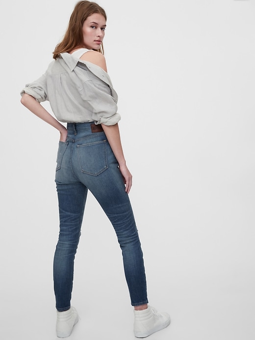 2 of 8 showing, with the color medium indigo of product 1969 Premium Sky High Distressed Skinny Jeans