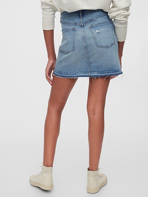 2 of 8 showing, with the color medium wash of product Distressed Denim Mini Skirt