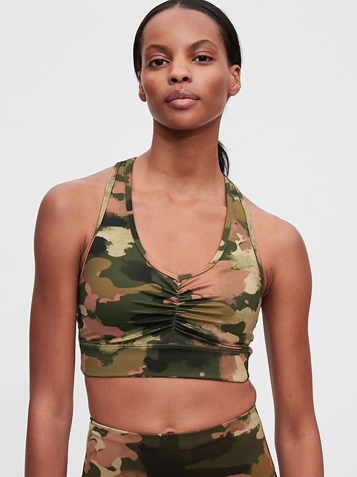 1 of 8 showing, with the color olive green camo of product GapFit Eclipse Medium Impact T-Back Longline Sports Bra
