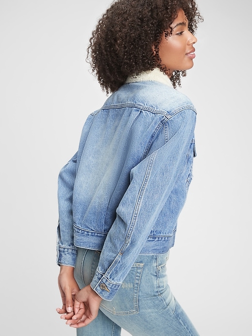 2 of 8 showing, with the color medium indigo of product Dolman Denim Sherpa Icon Jacket