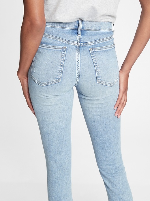 2 of 8 showing, with the color light indigo destroy of product High Rise Distressed True Skinny Jeans with Secret Smoothing Pockets