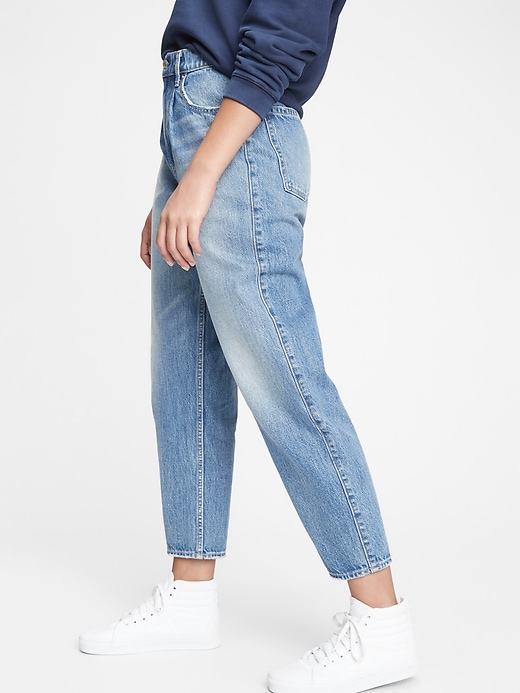 1 of 8 showing, with the color light indigo of product High Rise Barrel Jeans