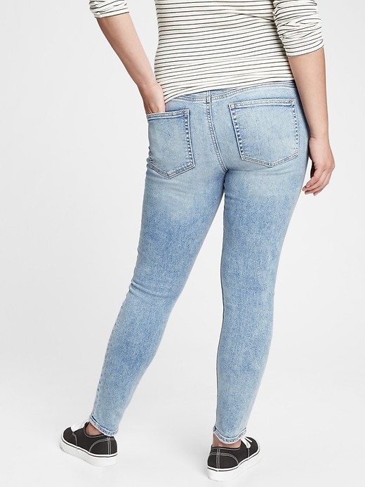 2 of 8 showing, with the color light indigo destroy of product Maternity True Waistband Full Panel Distressed Skinny Jeans With Washwell™