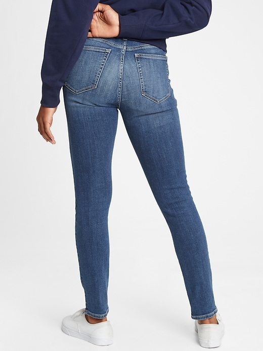2 of 8 showing, with the color dark blue indigo of product High Rise True Skinny Jeans with Secret Smoothing Pockets