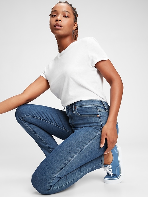 1 of 8 showing, with the color medium indigo of product High Rise True Skinny Jeans with Secret Smoothing Pockets