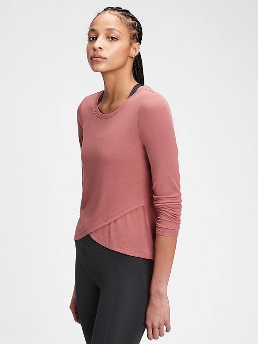 1 of 8 showing, with the color cosmetic pink of product GapFit Supersoft Ribbed Wrap-Front Top