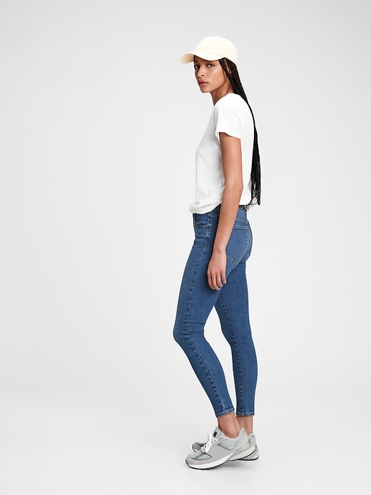 1 of 8 showing, with the color medium indigo of product Mid Rise Universal Jegging with Washwell