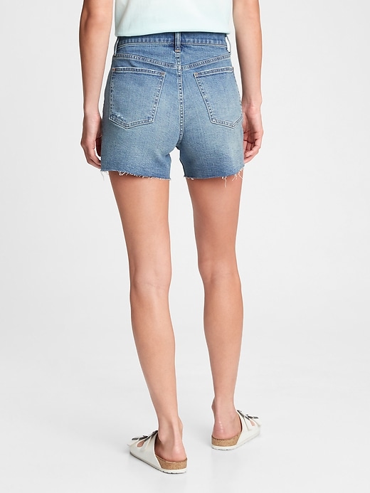 2 of 8 showing, with the color light indigo of product 4'' High Rise Button-Fly Denim Shorts With Washwell
