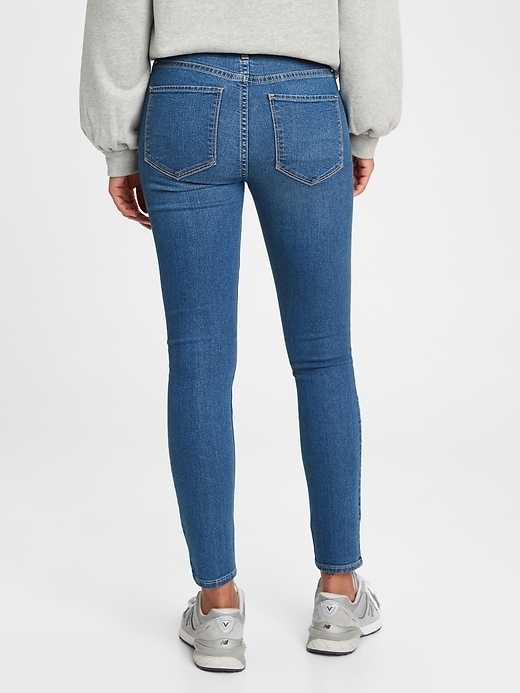 2 of 8 showing, with the color medium indigo of product Everyday Mid Rise Jegging with Washwell
