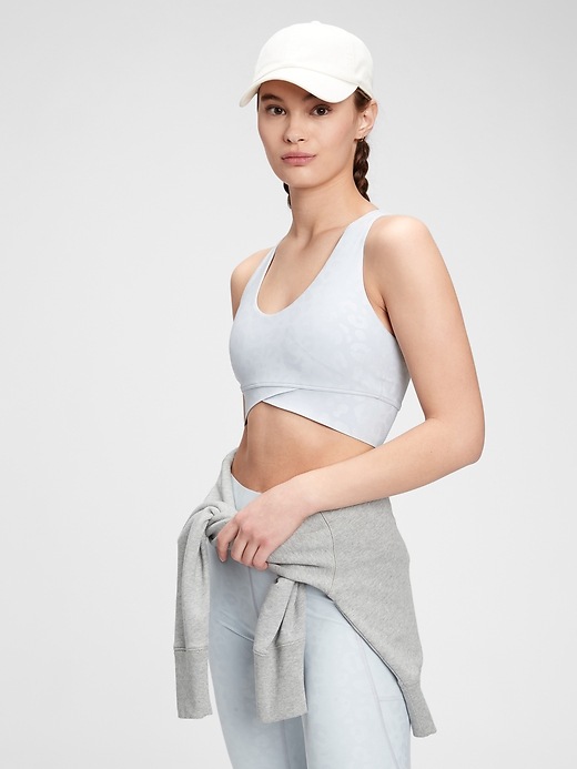 1 of 8 showing, with the color light grey leopard of product GapFit Sculpt Medium Impact Wrap Front Sports Bra